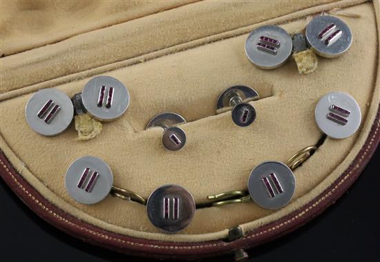 A 1930s Art Deco Cartier platinum? and ruby set eight piece dress stud set in original Cartier box, gross weight 39.3 grams.